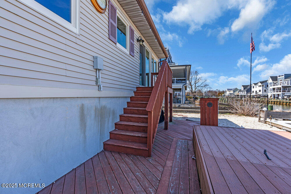 23 Bayview Drive Waretown, NJ 08758 - Photo 47 of 67 a view of a balcony with wooden floor