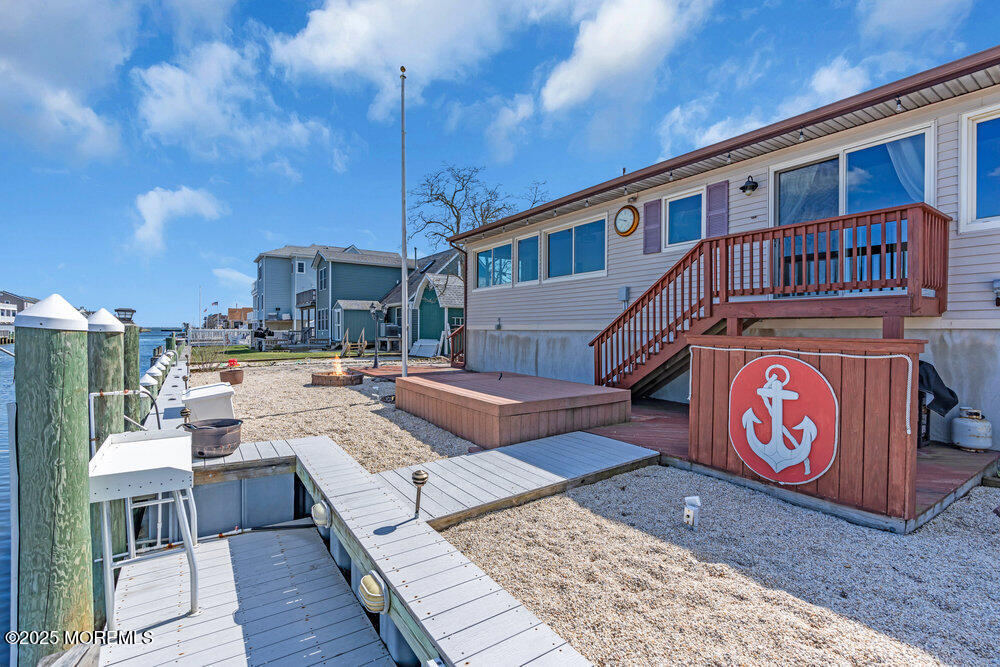 23 Bayview Drive Waretown, NJ 08758 - Photo 52 of 67 a view of a house with roof deck and sitting area