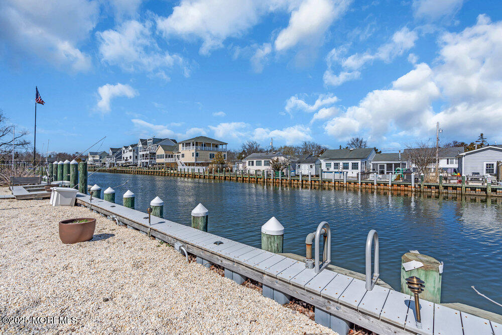 23 Bayview Drive Waretown, NJ 08758 - Photo 53 of 67 a view of a lake with boats and trees in the background
