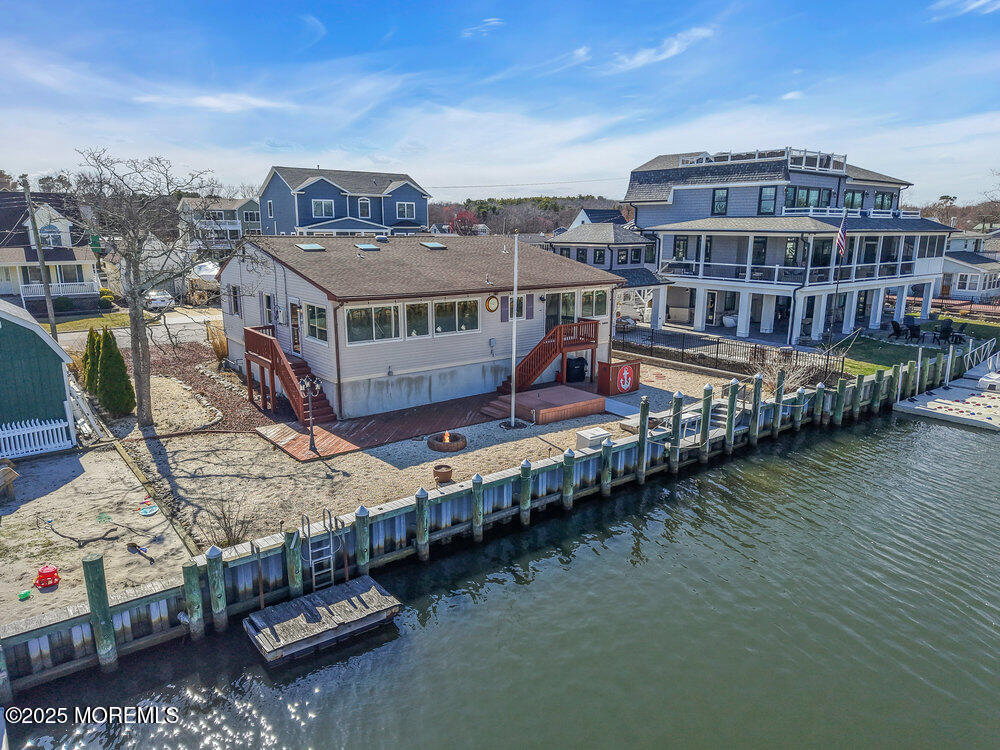 23 Bayview Drive Waretown, NJ 08758 - Photo 56 of 67 a view of a lake with building in front of it