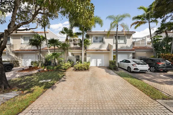 a view of a car park in front of house