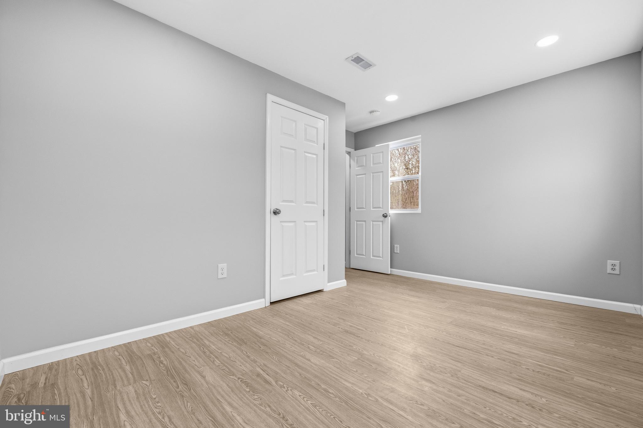 3720 Mt Pleasant Road Waldorf, MD 20601 - Photo 22 of 31 a view of an empty room with wooden floor and a window