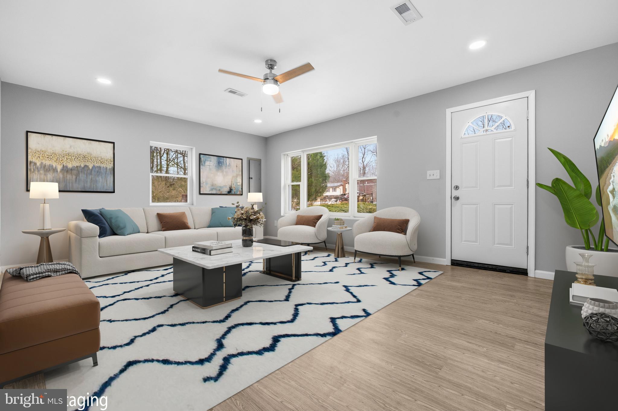 3720 Mt Pleasant Road Waldorf, MD 20601 - Photo 5 of 31 a living room with furniture and a flat screen tv