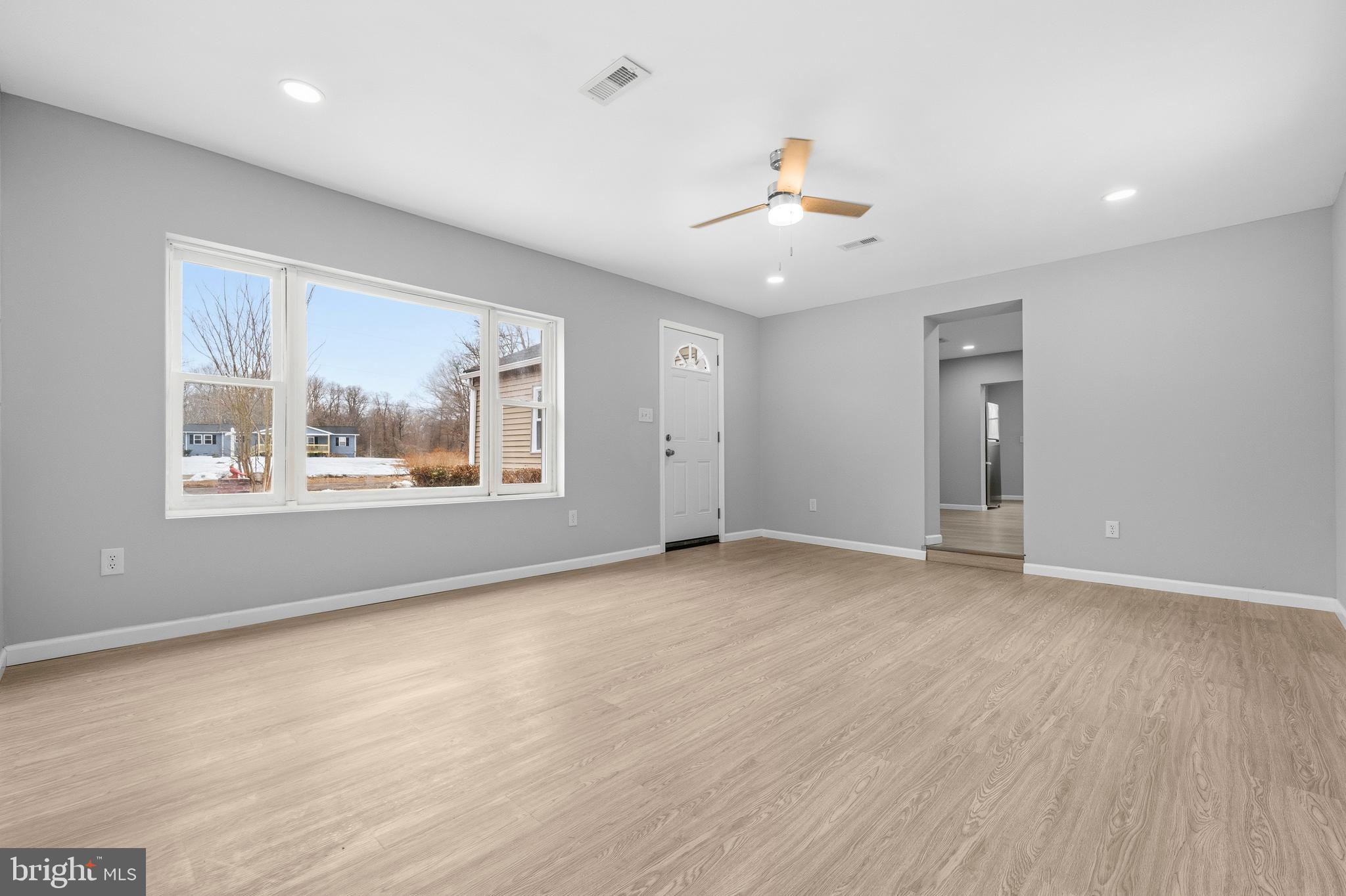 3720 Mt Pleasant Road Waldorf, MD 20601 - Photo 7 of 31 wooden floor in an empty room with a window