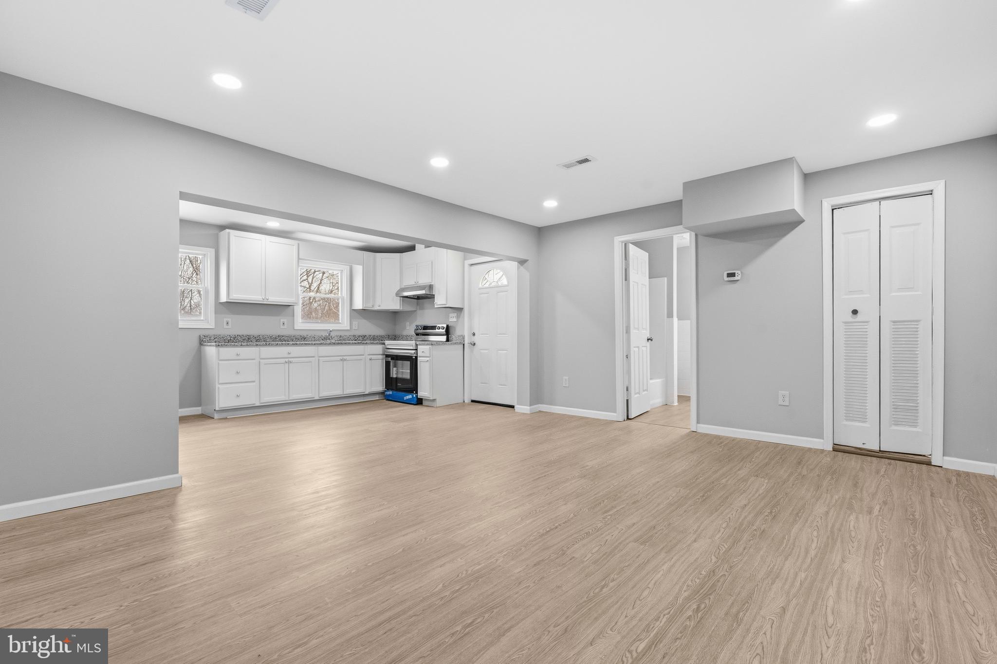 3720 Mt Pleasant Road Waldorf, MD 20601 - Photo 31 of 31 a view of empty room with wooden floor and kitchen