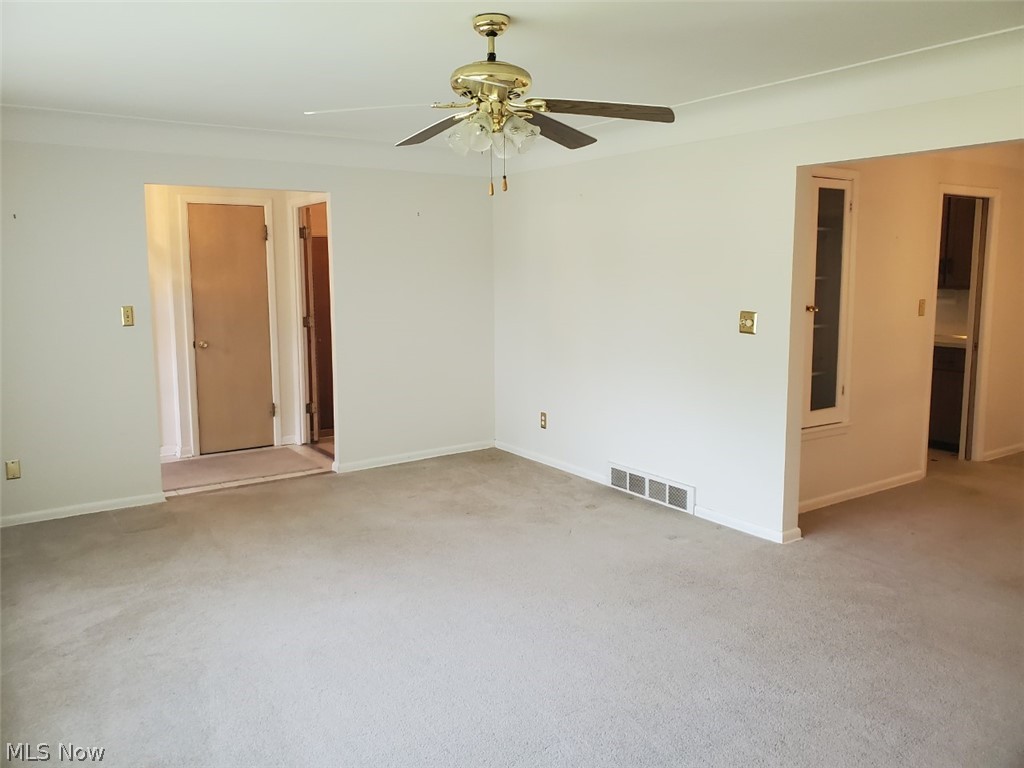 5670 Faraday Road Cleveland, OH 44124 - Photo 26 of 26 LIVING ROOM. OPEN FLOOR PLAN. HARDWOOD FLOORS UNDERNEATH CARPETING.