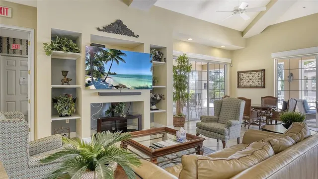 swimming pool view with a seating space and a garden view