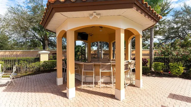 an aerial view of a house with outdoor seating