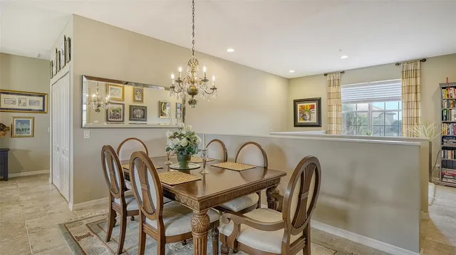 a dining room with furniture and window
