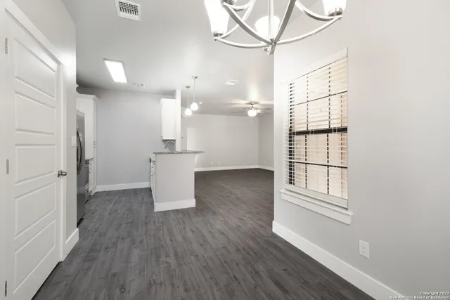 a kitchen with stainless steel appliances granite countertop a sink stove and microwave