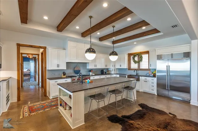 a kitchen with a stove a refrigerator and a stove