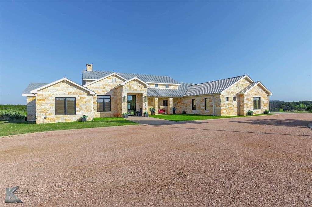 226 Rabbit Run Tuscola, TX 79562 - Photo 2 of 40 a view of street with large windows and wooden fence
