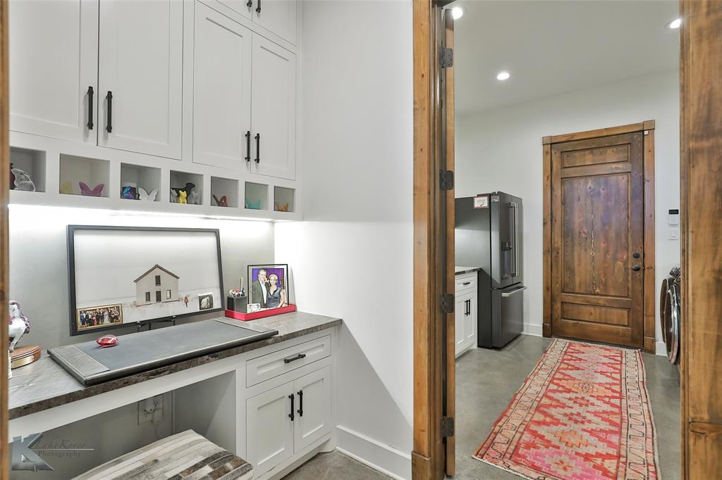226 Rabbit Run Tuscola, TX 79562 - Photo 25 of 40 a kitchen with stainless steel appliances granite countertop a refrigerator and a sink