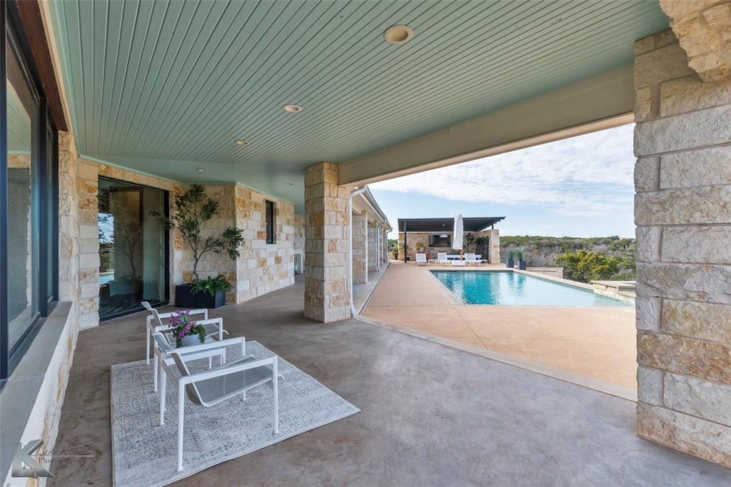 226 Rabbit Run Tuscola, TX 79562 - Photo 29 of 40 a view of a livingroom with furniture and floor to ceiling window
