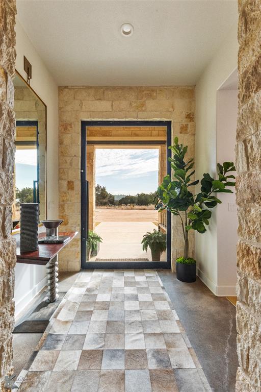 226 Rabbit Run Tuscola, TX 79562 - Photo 4 of 40 a view of entryway with wooden floor