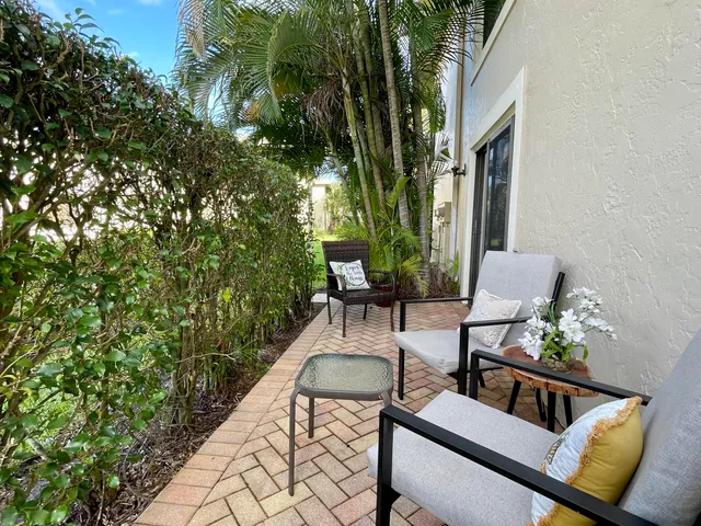 a view of a chairs and table in a patio