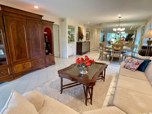 a living room with furniture and a table