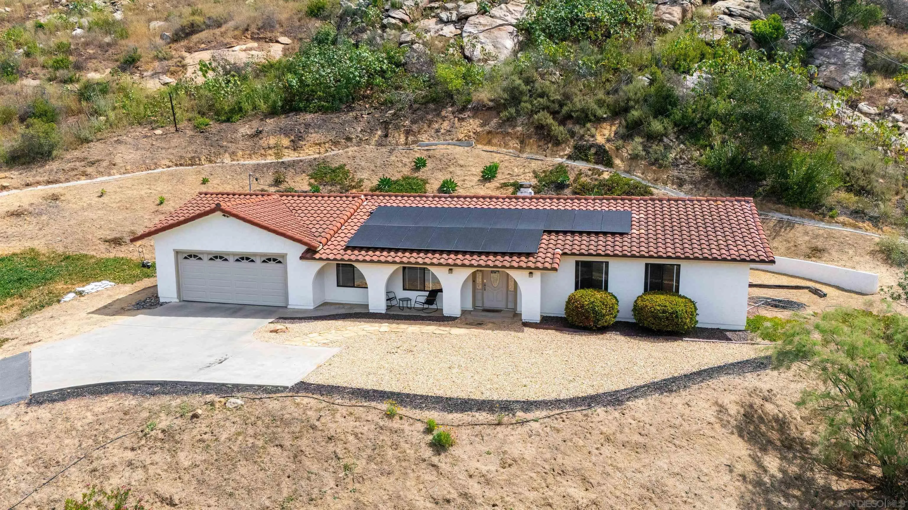 32721 Mountain View Road Bonsall, CA 92003 - Photo 2 of 33 front view of a house with a yard