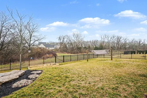 a swimming pool with an outdoor seating and yard