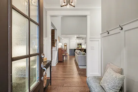 a hallway with furniture and a rug