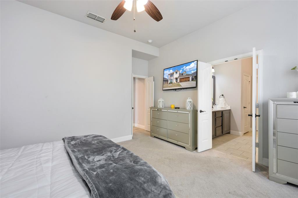 4059 Three Forks Road Kaufman, TX 75142 - Photo 14 of 25 a bed room with a bed and a ceiling fan
