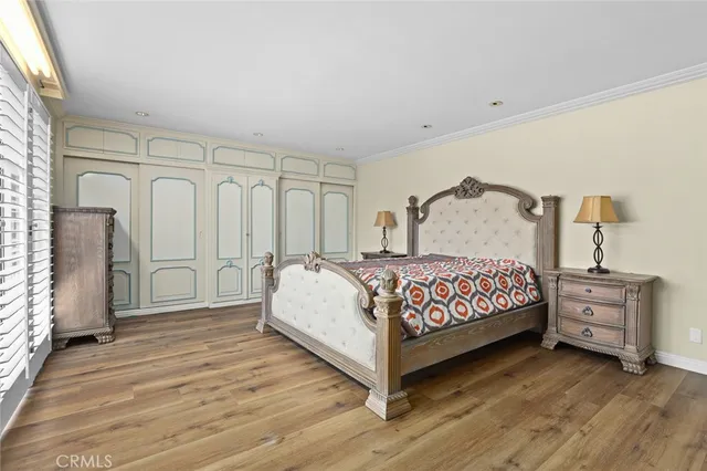 a bedroom with a bed and cabinets