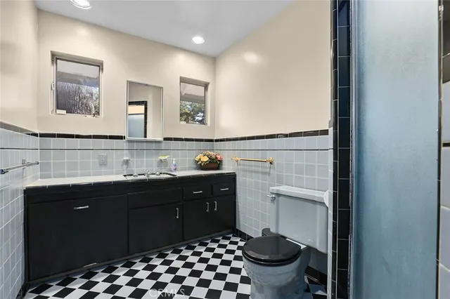 a spacious bathroom with a sink and a mirror