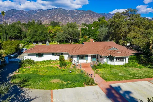 a aerial view of a house with a garden