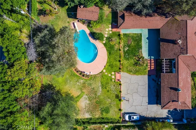 an aerial view of a house with a swimming pool