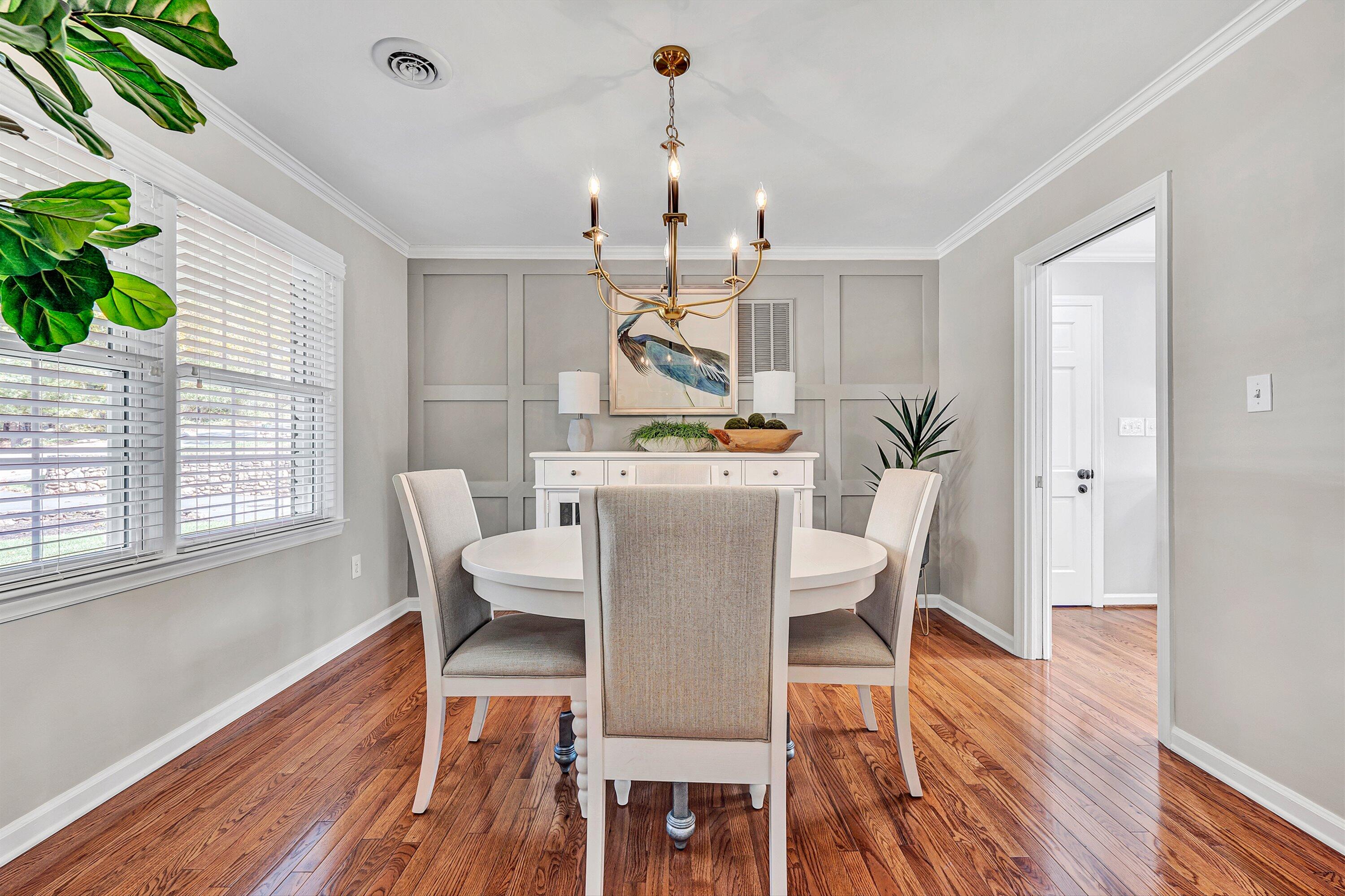 5063 Falcon Ridge Road Roanoke, VA 24018 - Photo 13 of 82 a dining room with furniture potted plants and wooden floor