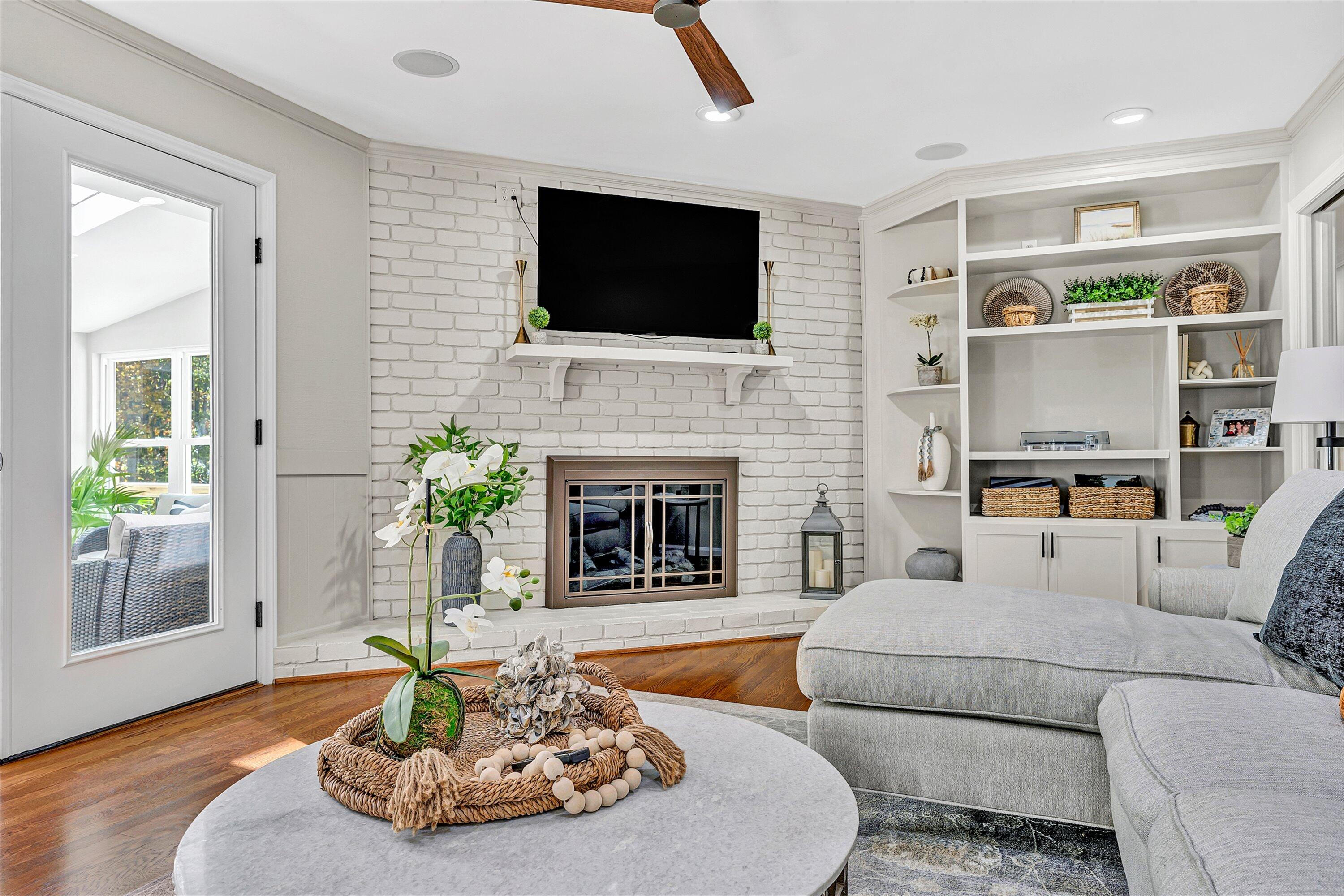 5063 Falcon Ridge Road Roanoke, VA 24018 - Photo 17 of 82 a living room with furniture a fireplace and a flat screen tv