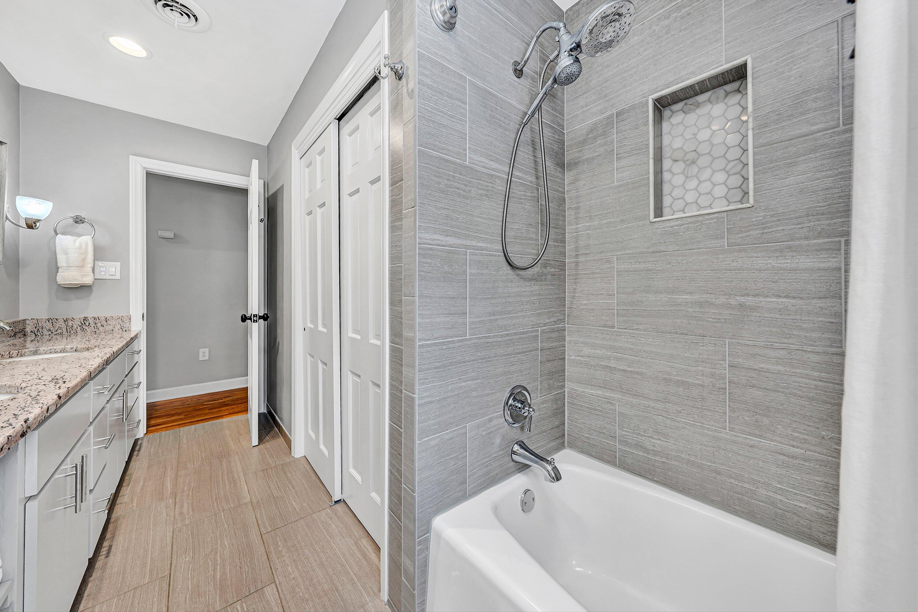 5063 Falcon Ridge Road Roanoke, VA 24018 - Photo 35 of 82 a bathroom with a granite countertop bathtub shower sink and toilet