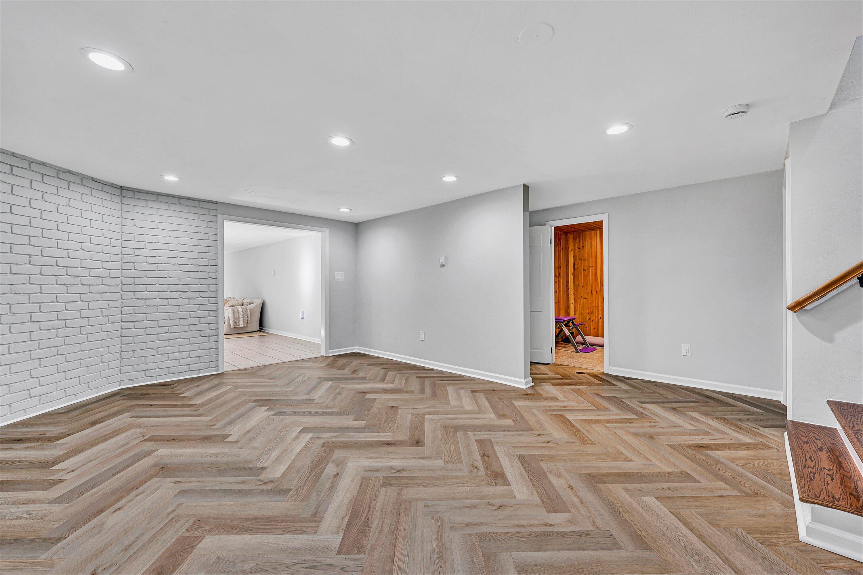 5063 Falcon Ridge Road Roanoke, VA 24018 - Photo 47 of 82 a view of an empty room with wooden floor and windows