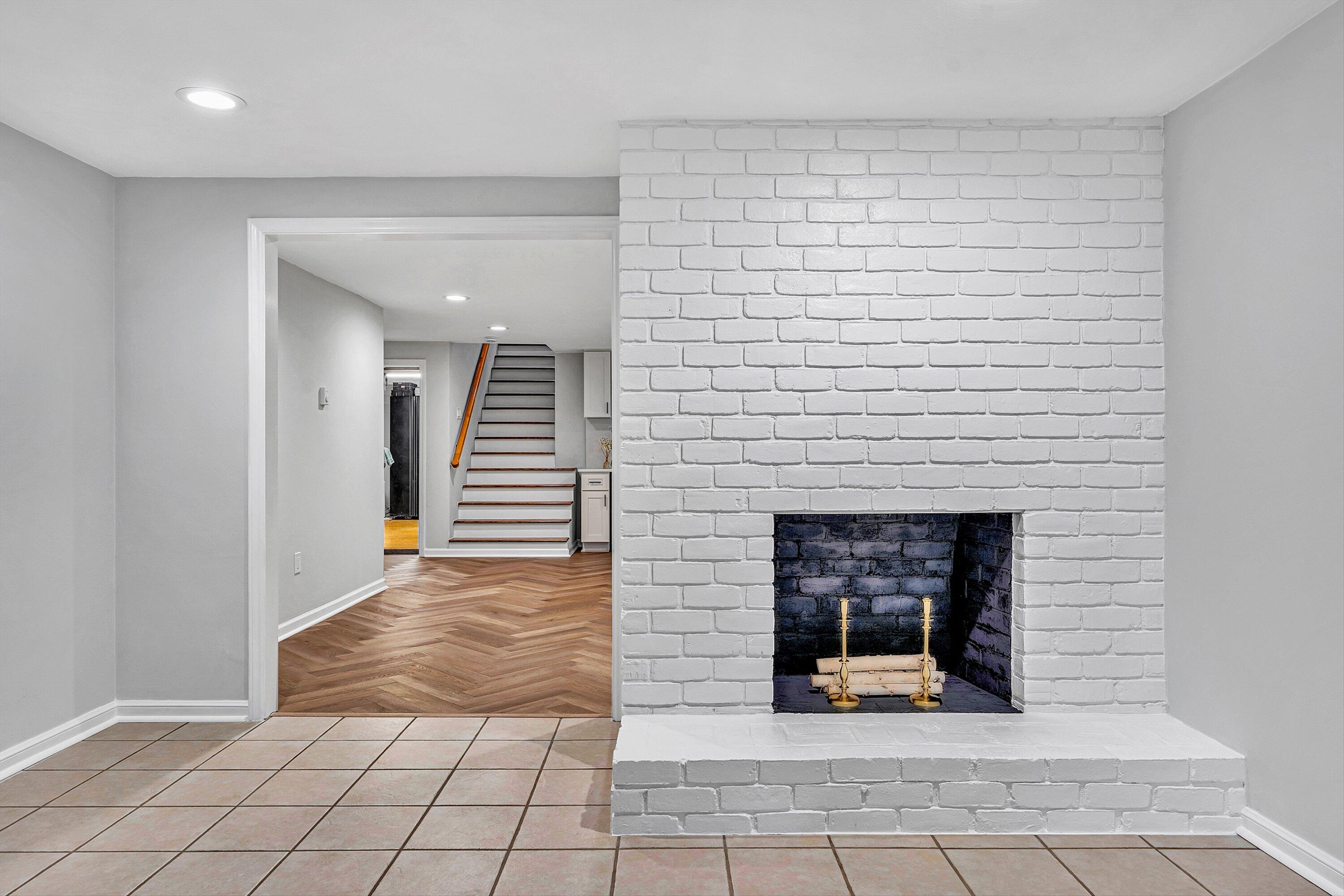 5063 Falcon Ridge Road Roanoke, VA 24018 - Photo 53 of 82 a view of a hallway with wooden floor and a fireplace