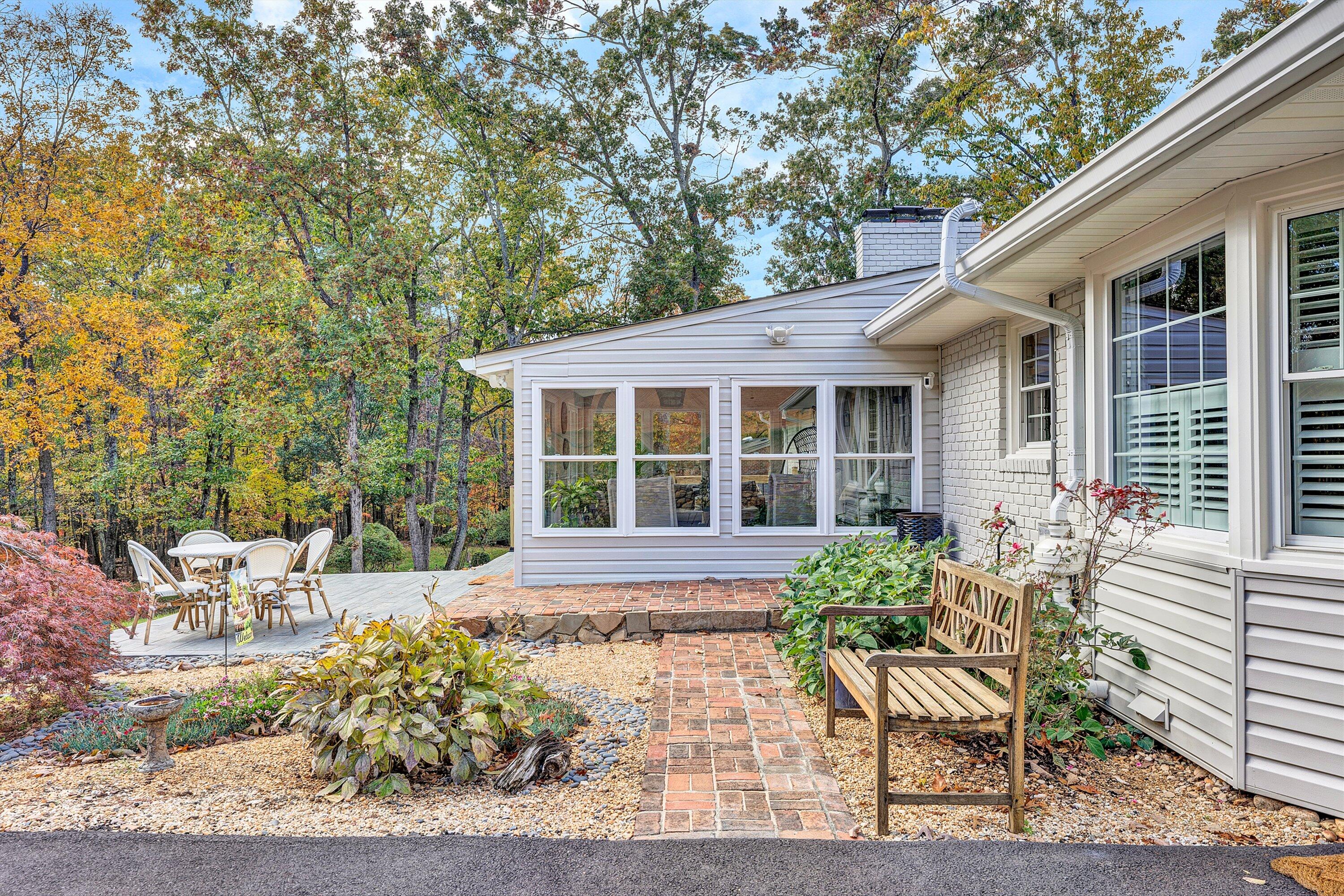 5063 Falcon Ridge Road Roanoke, VA 24018 - Photo 65 of 82 a view of a house with backyard sitting area and garden