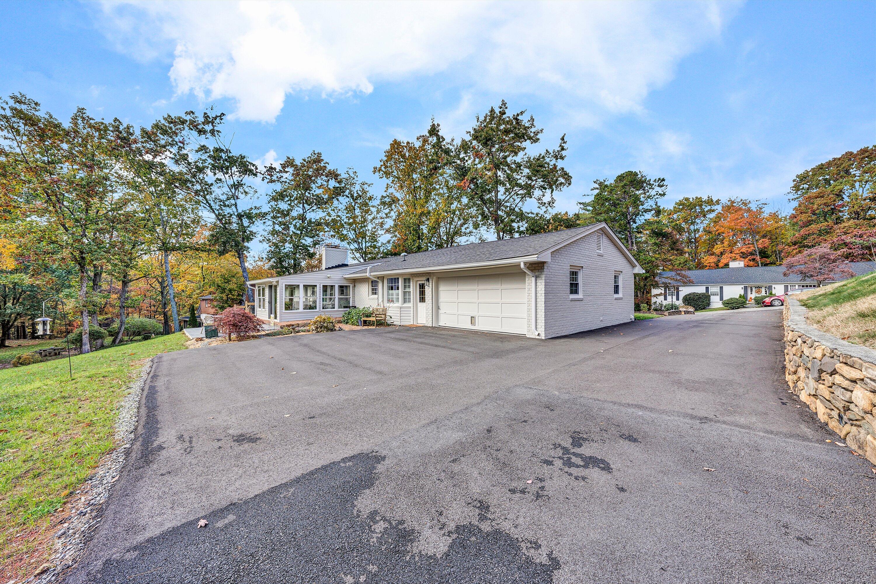 5063 Falcon Ridge Road Roanoke, VA 24018 - Photo 68 of 82 a view of a house with a yard and large trees