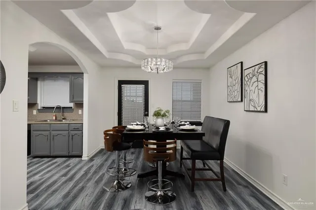 a view of a dining room with furniture and window