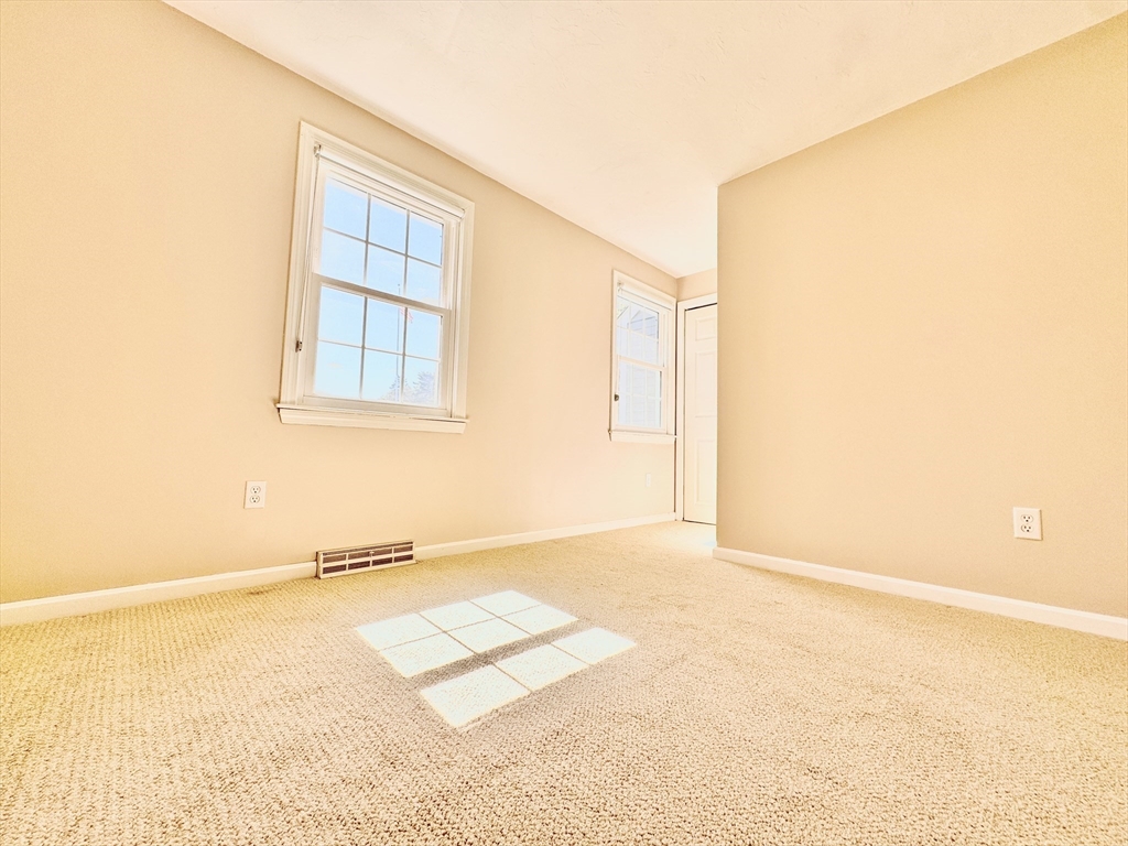 7 Washington Green, Unit 7 Walpole, MA 02032 - Photo 13 of 23 a view of an empty room with a window