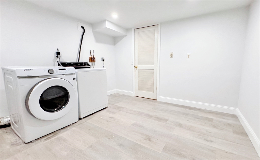7 Washington Green, Unit 7 Walpole, MA 02032 - Photo 17 of 23 a view of a storage & utility room with washer and dryer