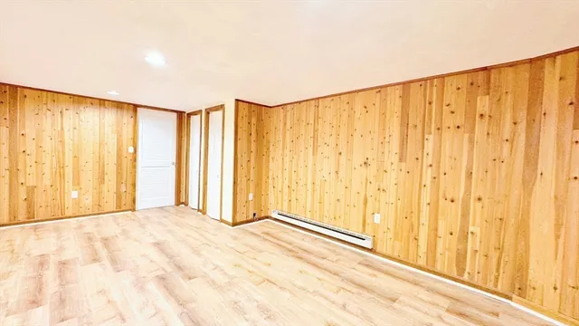a view of a room with a window and a shower