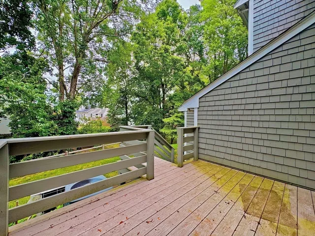 a view of a wooden deck with a bench