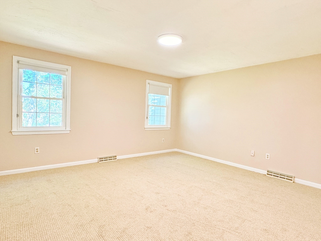 7 Washington Green, Unit 7 Walpole, MA 02032 - Photo 9 of 23 an empty room with a window