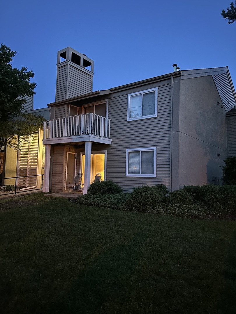 49 Orchard Terrace, Unit 2 Lombard, IL 60148 - Photo 1 of 2 a front view of a house with a garden