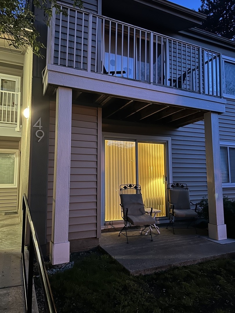 49 Orchard Terrace, Unit 2 Lombard, IL 60148 - Photo 2 of 2 a view of a backyard with a sitting area
