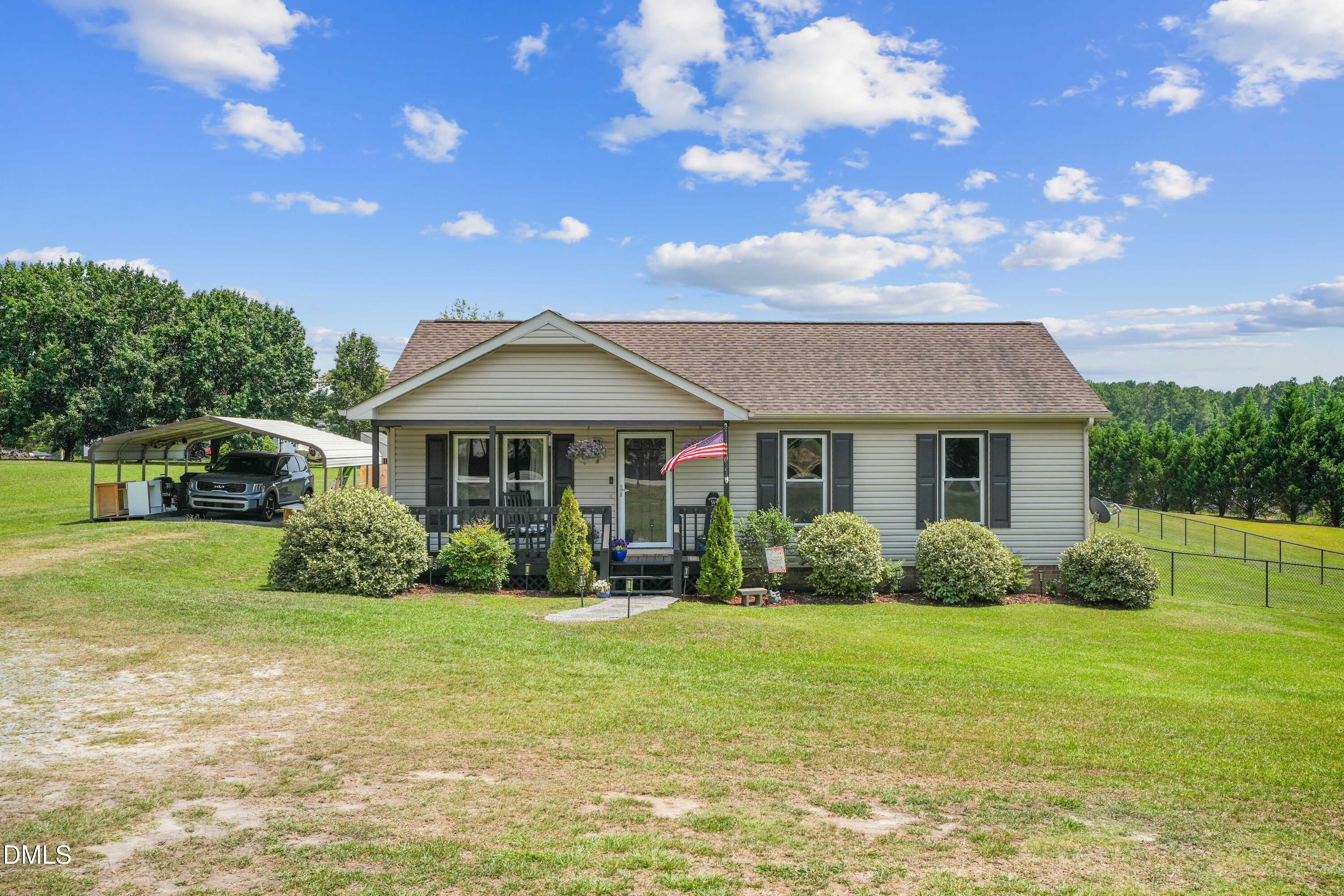 101 Stephenson Road Benson, NC 27504 - Photo 1 of 29 a front view of a house with garden