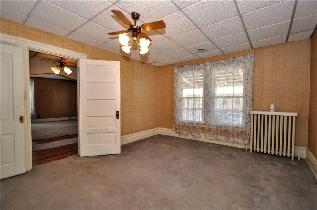 509 West Main Street Monongahela, PA 15063 - Photo 12 of 39 an empty room with chandelier fan and windows