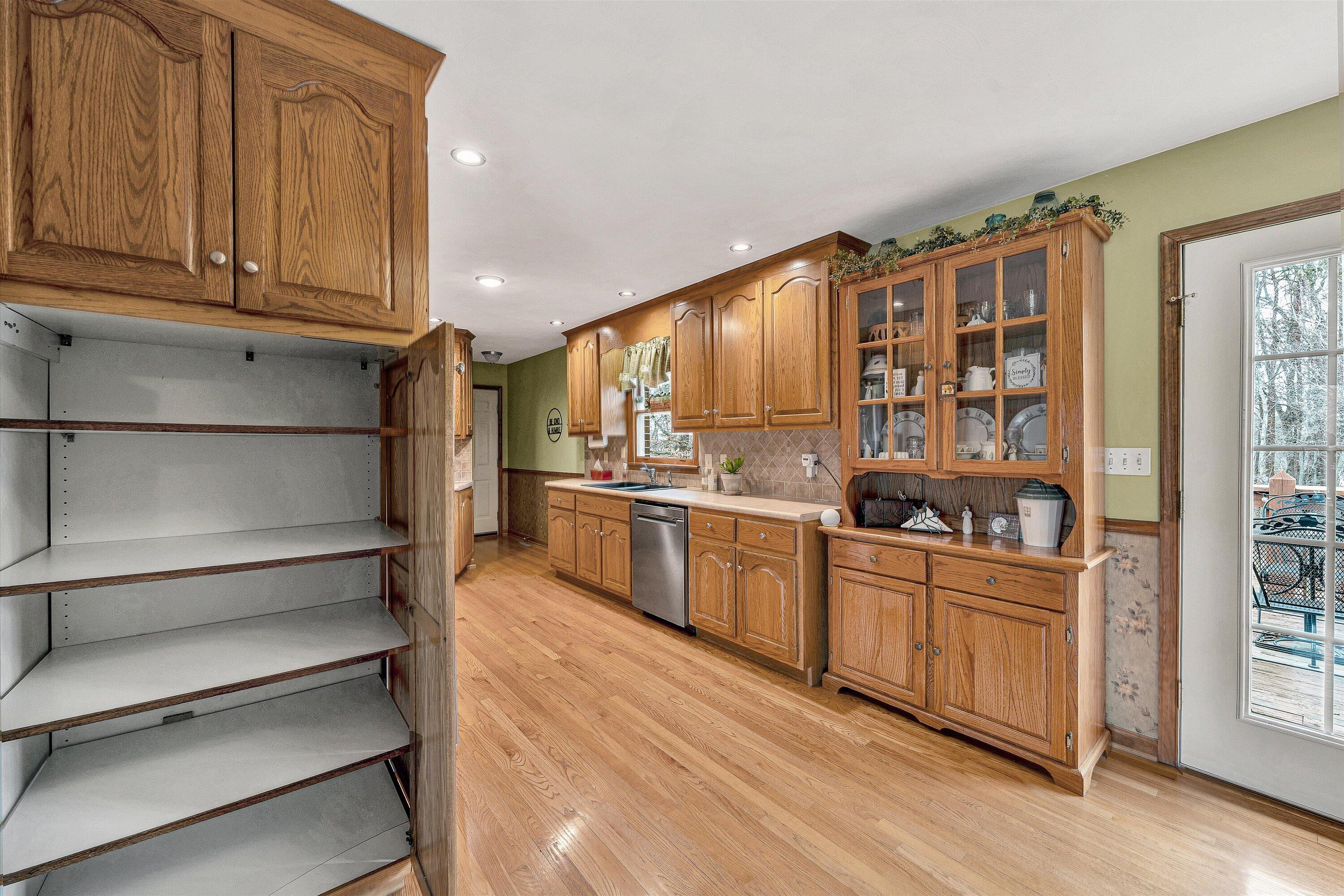 460 Stonybrook Road Wirtz, VA 24184 - Photo 11 of 44 a kitchen with stainless steel appliances granite countertop a refrigerator and cabinets