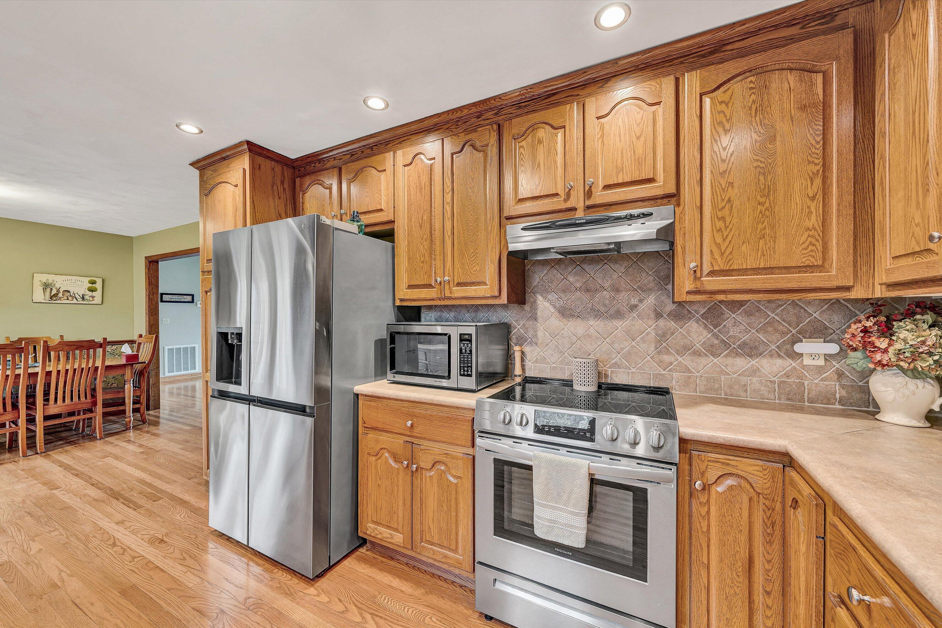 460 Stonybrook Road Wirtz, VA 24184 - Photo 13 of 44 a kitchen with stainless steel appliances granite countertop a refrigerator stove and sink