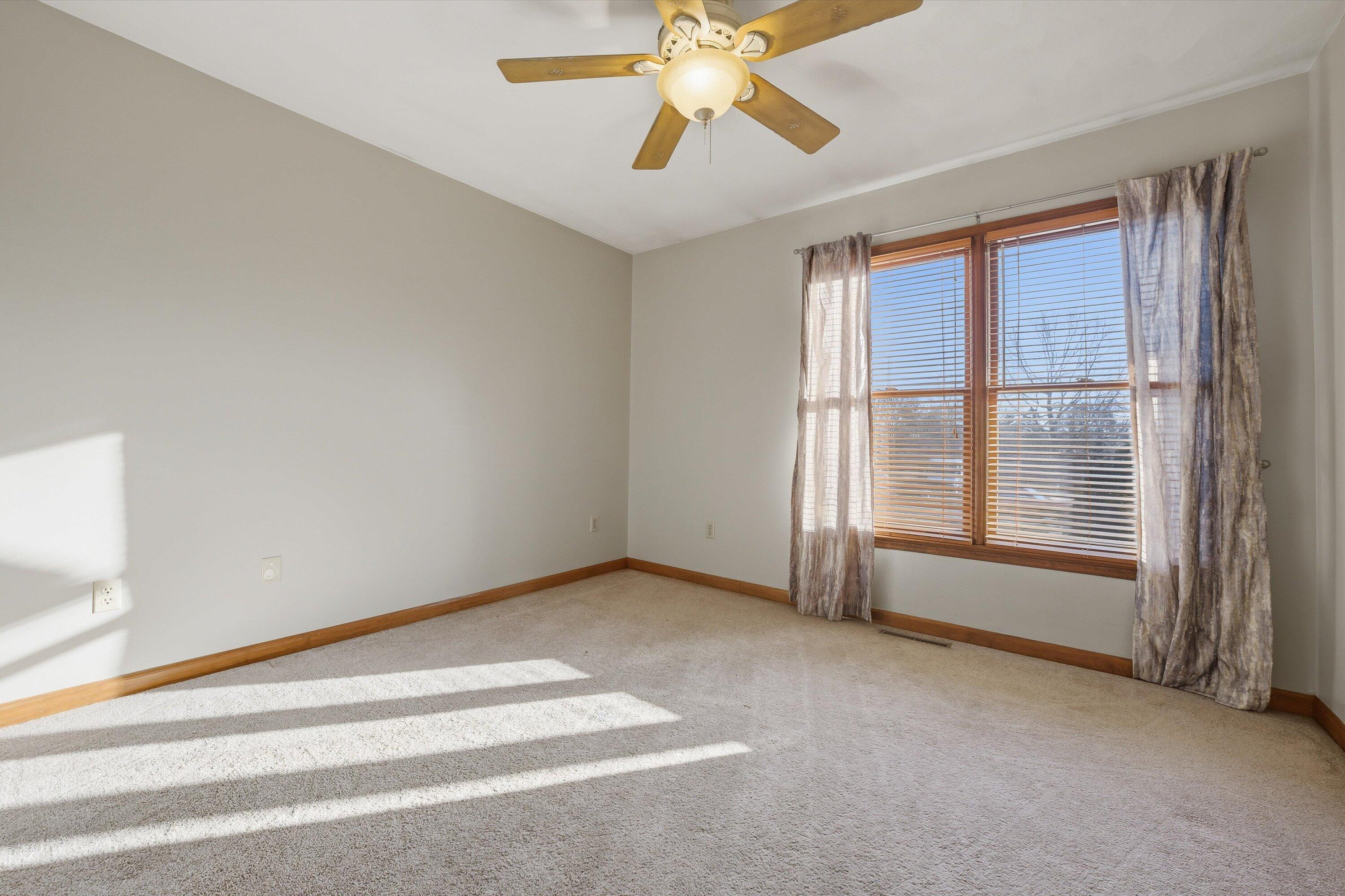 460 Stonybrook Road Wirtz, VA 24184 - Photo 21 of 44 a view of an empty room with chandelier fan and fire place