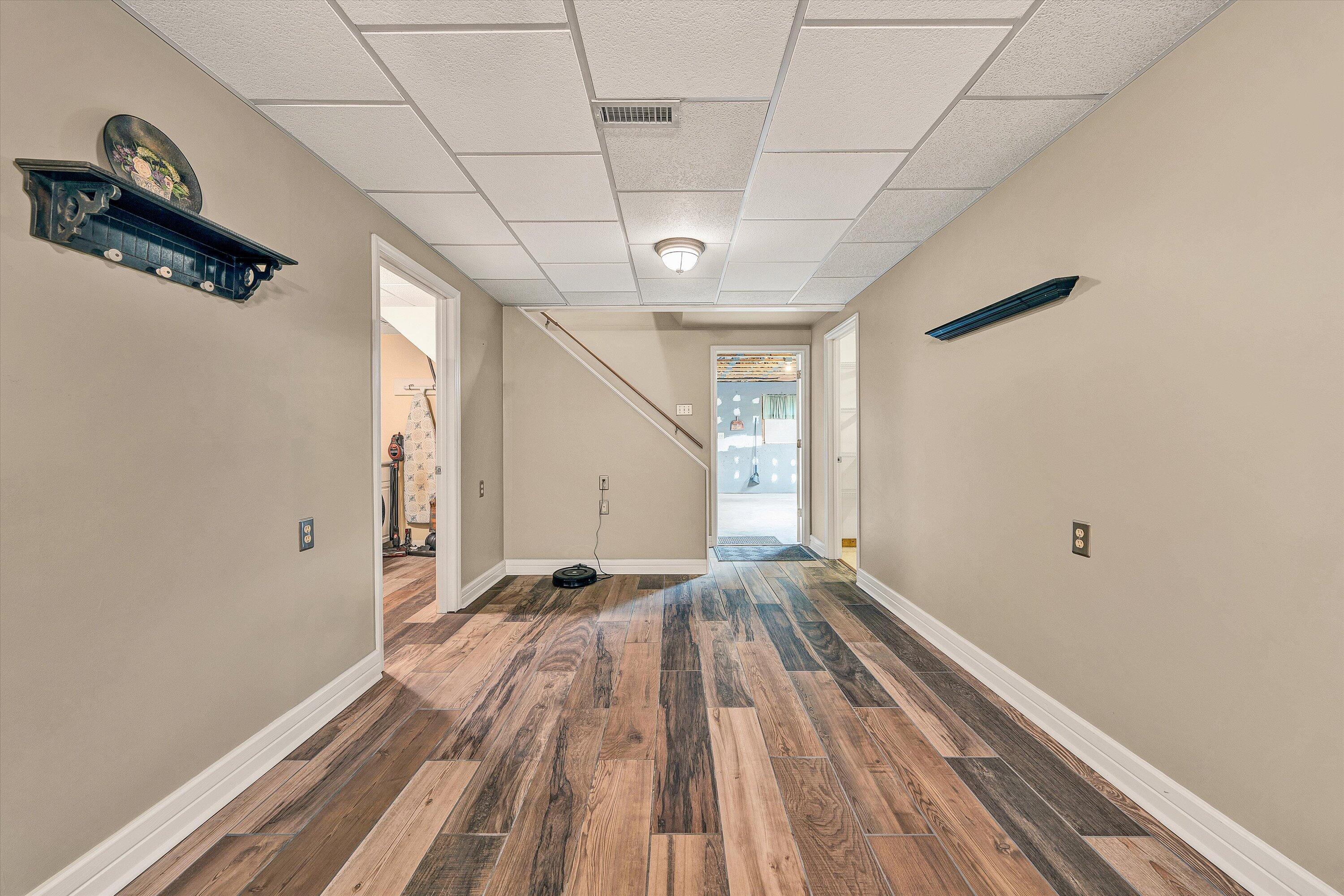 460 Stonybrook Road Wirtz, VA 24184 - Photo 24 of 44 a view of a room with wooden floor and a ceiling fan